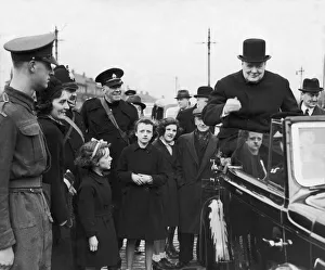 00363 Gallery: Prime Minister Winston Churchill sitting on the back of an open car on his surprise visit