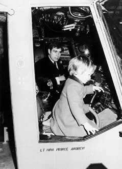 Images Dated 6th February 1986: Prince Andrew with Prince William onboard HMS Brazen on the River Thames near London