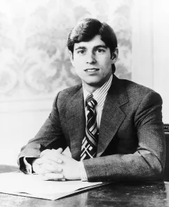 Prince Andrew sitting at a desk with hands together September 1979 Prince Andrew sitting at a desk with hands together September 1979
