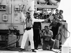 Prince Charles acting as batman to guide the helicopter of HMS Jupiter flight deck Prince Charles acting as batman to guide the helicopter of HMS Jupiter flight deck