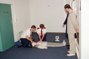 Prince Charles being demonstrated resuscitation techniques on an inflatable doll at an Prince Charles being demonstrated resuscitation techniques on an inflatable doll at an