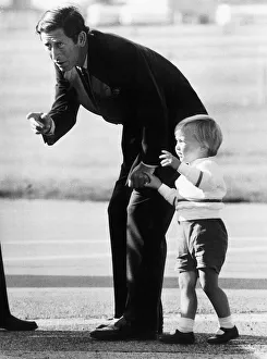 Prince Charles gets down to conversation with his son William at Aberdeen Airport Prince Charles gets down to conversation with his son William at Aberdeen Airport