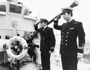 Prince Charles leaving the Royal Navy saluting his shipmates aboard the minehunter Prince Charles leaving the Royal Navy saluting his shipmates aboard the minehunter