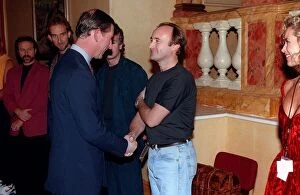 Images Dated 16th November 1992: Prince Charles November 1992 shakes hands with musician Phil Collins as the rest of