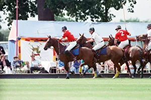 Images Dated 16th July 1991: Prince Charles (Red shirt wearing number 3) was locked in a fierce battle with Princess