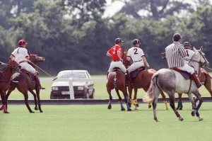 Images Dated 16th July 1991: Prince Charles (Red shirt wearing number 3) was locked in a fierce battle with Princess