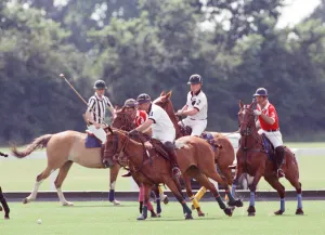 Images Dated 16th July 1991: Prince Charles (Red shirt wearing number 3) was locked in a fierce battle with Princess
