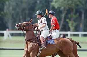 Images Dated 16th July 1991: Prince Charles (Red shirt wearing number 3) was locked in a fierce battle with Princess