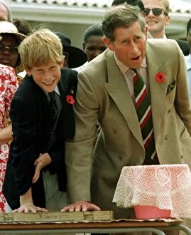 Images Dated 3rd November 1997: Prince Charles with his son Prince Harry leaving their hand prints in concrete on their