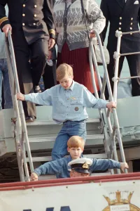 Prince Harry and his brother Prince William (behind) during their tour of Canada Prince Harry and his brother Prince William (behind) during their tour of Canada