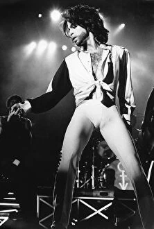 Prince performing on stage during The Nude Tour'