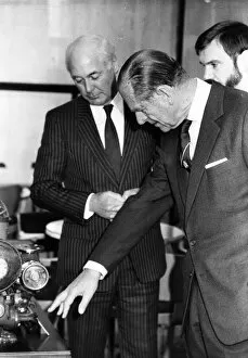 Prince Philip, Duke of Edinburgh, examines some machinery with Terry Harrison, chairman