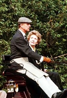 Prince Philip, the Duke of Edinburgh and Nancy Reagan sitting in a carriage driving in Prince Philip, the Duke of Edinburgh and Nancy Reagan sitting in a carriage driving in