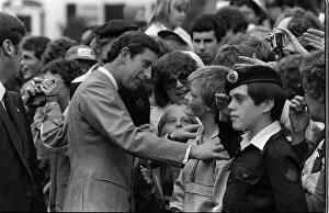 Prince and Princess of Wales in Canada 1983 Prince Charles inspects a young boy'