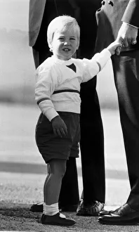 Prince William grips the finger of father Prince Charles at Aberdeen airport Prince William grips the finger of father Prince Charles at Aberdeen airport