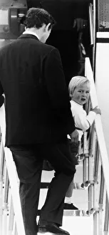 Prince William with Prince Charles at Aberdeen Airport, climbing the stairway to Prince William with Prince Charles at Aberdeen Airport, climbing the stairway to