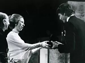 Images Dated 22nd March 1979: Princess Anne presents actor Christopher Reeve with the BAFTA award for the most