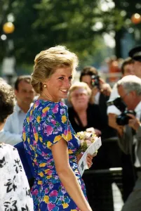 Princess Diana in blue dress with flower pattern holding bouquet of flowers 19th Princess Diana in blue dress with flower pattern holding bouquet of flowers 19th