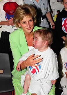 Princess Diana with Darius Wyke sitting on her knee on a visit to a Children' Princess Diana with Darius Wyke sitting on her knee on a visit to a Children'