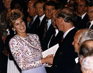 Images Dated 26th October 1992: Princess Diana laughing with Prince Charles after meeting members of England'