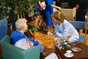 Princess Diana pictured with pensioner Helen McCaffrey during a visit to the Bo'
