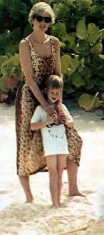 Images Dated 4th November 1990: Princess Diana poses on the beach with her son Prince Harry on holiday in the Bahamas