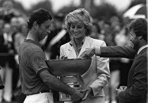 Images Dated 1st July 1987: PRINCESS DIANA PRESENTS PRINCE CHARLES WITH A TROPHY AT A POLO MATCH. JULY 1987 (87 / 4518)