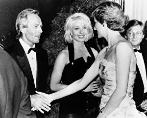 Princess Diana shakes hands with Australian actor Paul Hogan at the premiere of his film