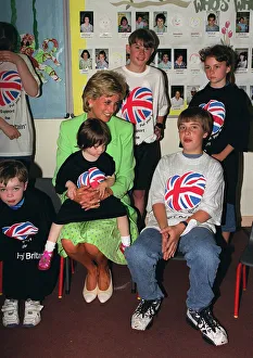 Princess Diana sitting with Caitlin Hines on her lap during a visit to a children' Princess Diana sitting with Caitlin Hines on her lap during a visit to a children'