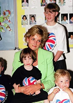Princess Diana sitting with Caitlin Hines on her lap during a visit to a children' Princess Diana sitting with Caitlin Hines on her lap during a visit to a children'