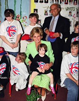 Princess Diana sitting with Caitlin Hines on her lap during a visit to a children' Princess Diana sitting with Caitlin Hines on her lap during a visit to a children'