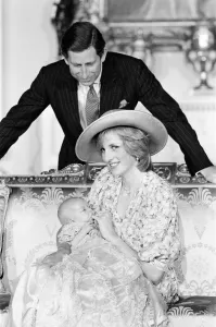 00511 Gallery: Princess Diana, watched by husband prince Charles, holds her son Prince William in her