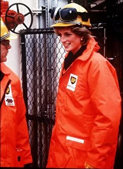 Princess Diana wearing a construction hard hat with protective ear guards
