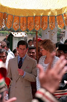 PRINCESS DIANA, WEARING PALE BLUE AND WHITE SKIRT SUIT, WITH PRINCE CHARLES DURING TOUR