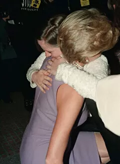 Images Dated 1st November 1996: Princess Diana, wearing a purple dress, hugs Emma Jones at a Commonwealth Day luncheon in