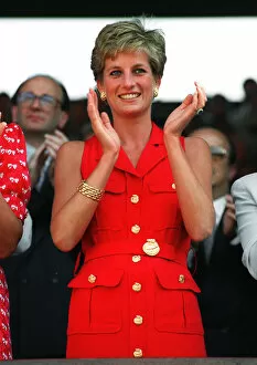 Princess Diana Gallery: Princess Diana, wearing red sleveless dress, applauds the play at the Wimbledon mens