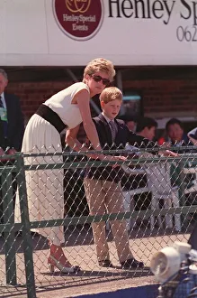 PRINCESS DIANA WEARING A WHITE DRESS AND PRINCE HARRY, STANDING BEHIND AND LOOKING OVER PRINCESS DIANA WEARING A WHITE DRESS AND PRINCE HARRY, STANDING BEHIND AND LOOKING OVER