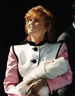 Images Dated 31st March 1990: Princess Eugenie being held by the duchess of york