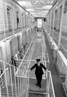 A prison guard on patrol in B wing of Britain's top security prison Parkhurst