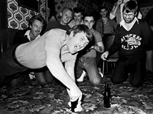 Images Dated 14th November 2011: Pub Olympics. bar divers, chairlifters and bottle walkers at the Cat