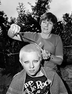 Punk girl Julie Brandon having her hair cut by her mother at their home in Thame Punk girl Julie Brandon having her hair cut by her mother at their home in Thame