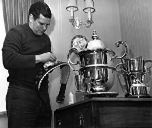 Images Dated 15th April 1971: Putting a shine on one of his trophies is British wrestler Count Bartelli in his Crewe