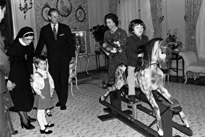 Images Dated 8th November 1976: Queen and Duke present a traditional British rocking horse of Victorian design