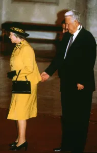 Queen Elizabeth with Boris Yeltsin standing behind and appearing to pinch the monarch Queen Elizabeth with Boris Yeltsin standing behind and appearing to pinch the monarch