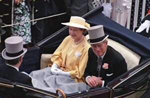 Queen Elizabeth II and The Duke Of Edinburgh, Prince Philip riding in a carriage during