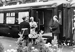 Queen Elizabeth II is greeted by Sir James Steel as she steps from the Royal Train at