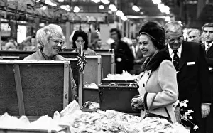 Queen Elizabeth II pauses to talk to one of the women on the assembly line during her Queen Elizabeth II pauses to talk to one of the women on the assembly line during her