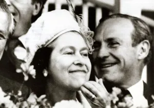 Queen Elizabeth II scratching her chin smiling at Melbourne racecourse Face looking Queen Elizabeth II scratching her chin smiling at Melbourne racecourse Face looking