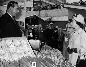 Queen Elizabeth II talks to Mr J Hand at his vegetable stall at the Bull Ring Queen Elizabeth II talks to Mr J Hand at his vegetable stall at the Bull Ring