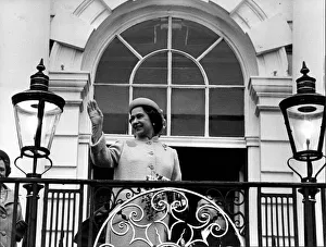 Queen Elizabeth II waves to the crowd from the balcony at Warrington Town Hall Queen Elizabeth II waves to the crowd from the balcony at Warrington Town Hall